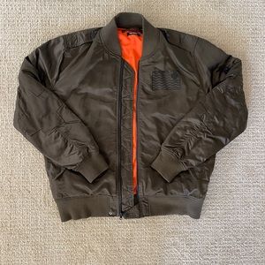 cool pink + dolphin olive bomber jacket with cross details! size men’s xlarge